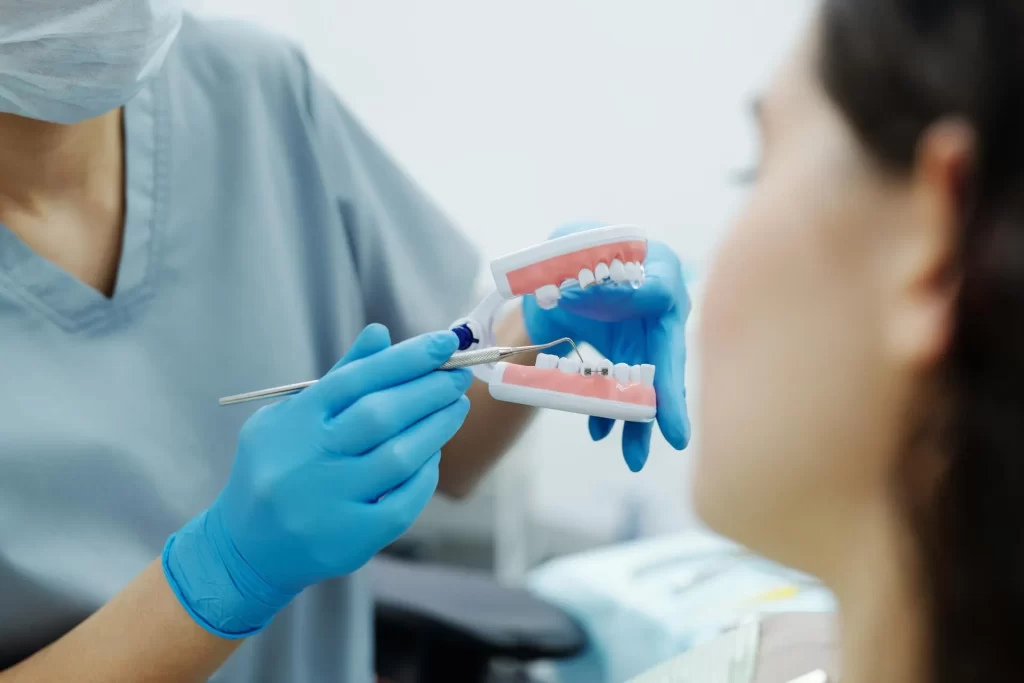 dentist showing braces to patient