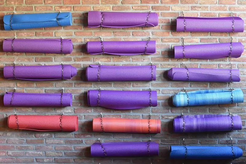 yoga and exercise mats hanging on wall